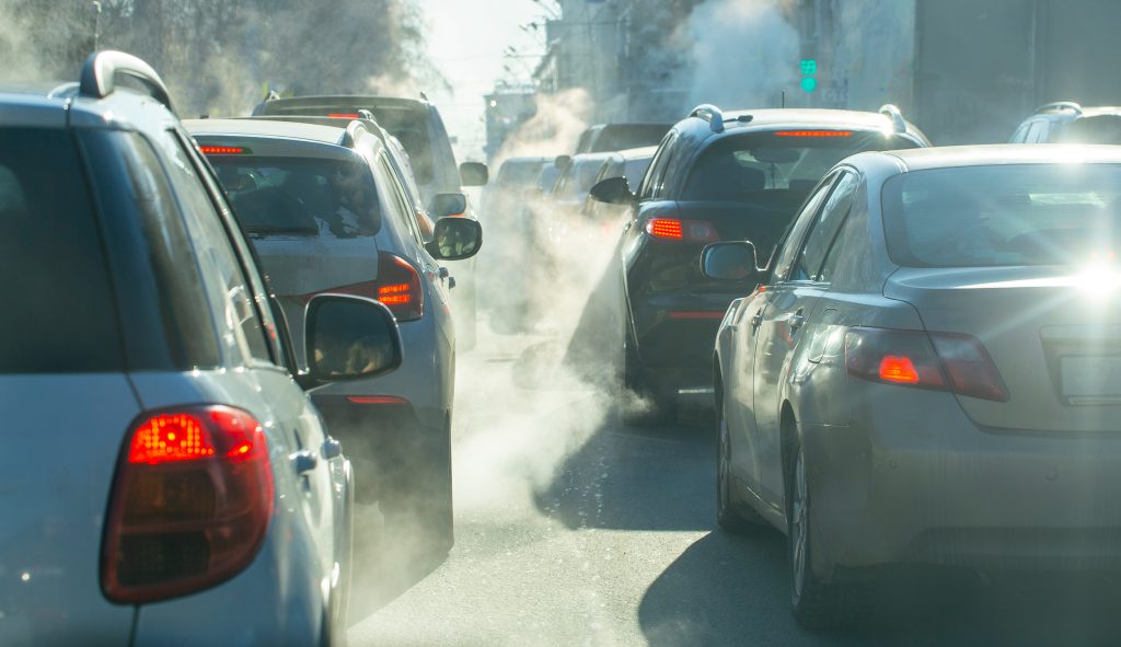 pollution from the exhaust of cars in the city in the winter. Sm